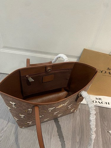 Coach x Peanuts Snoopy City Tote in Signature Canvas