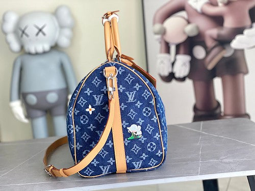 Louis Vuitton Keepall Bandoulière-style travel bag