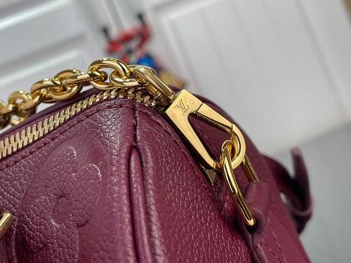 Louis Vuitton Speedy Bandoulière 20 Monogram Empreinte Leather in a Grenat