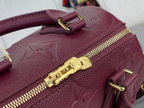 Louis Vuitton Speedy Bandoulière 20 Monogram Empreinte Leather in a Grenat