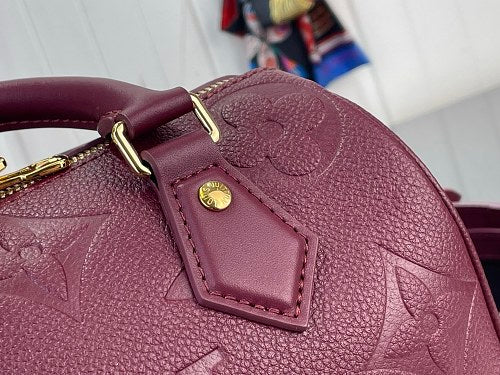 Louis Vuitton Speedy Bandoulière 20 Monogram Empreinte Leather in a Grenat