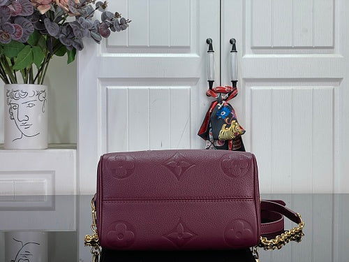 Louis Vuitton Speedy Bandoulière 20 Monogram Empreinte Leather in a Grenat