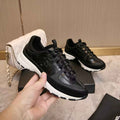 Chanel CC Black & White Low-Top Runner Sneakers
