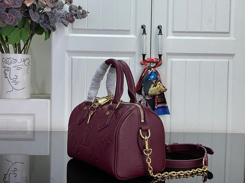 Louis Vuitton Speedy Bandoulière 20 Monogram Empreinte Leather in a Grenat
