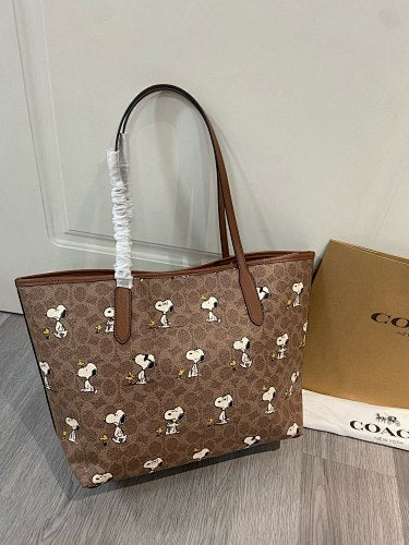Coach x Peanuts Snoopy City Tote in Signature Canvas