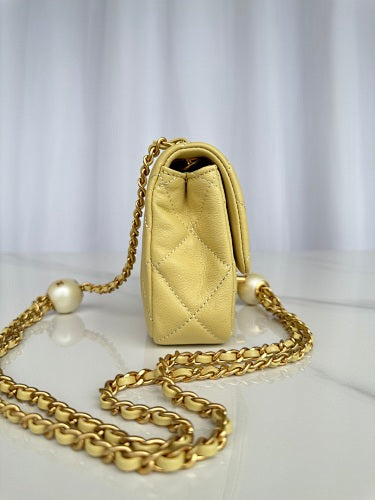 Chanel Yellow Quilted Flap Bag with Pearl-Embellished Chain Strap