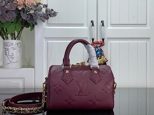 Louis Vuitton Speedy Bandoulière 20 Monogram Empreinte Leather in a Grenat