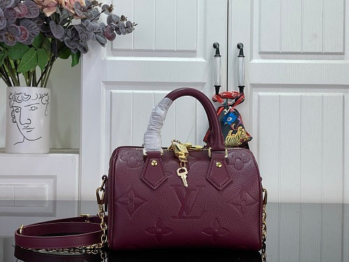Louis Vuitton Speedy Bandoulière 20 Monogram Empreinte Leather in a Grenat