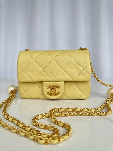 Chanel Yellow Quilted Flap Bag with Pearl-Embellished Chain Strap